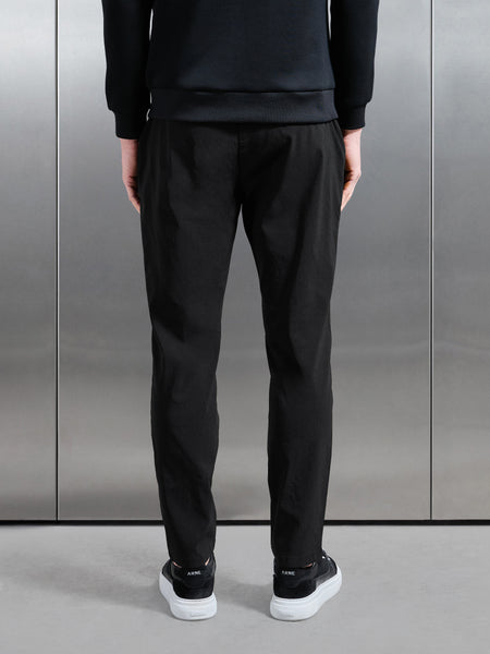 ESSENTIALNYLONTROUSERINBLACK2_CC_600x600.jpg