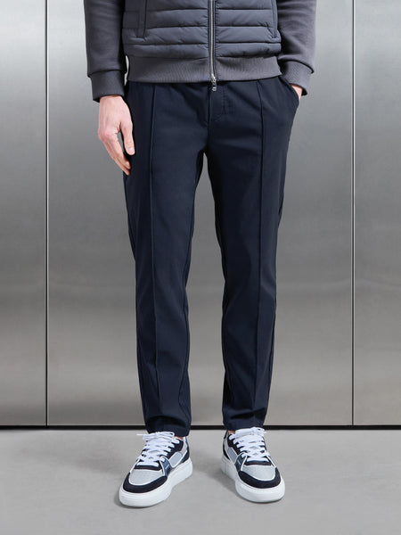 ESSENTIALNYLONTROUSERINNAVY1_CC_600x600.jpg
