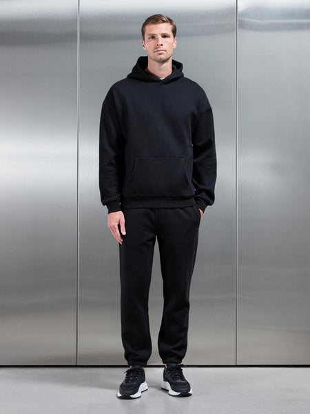 ESSENTIALRELAXEDHOODIEINBLACK-149614346571541_600x600.jpg
