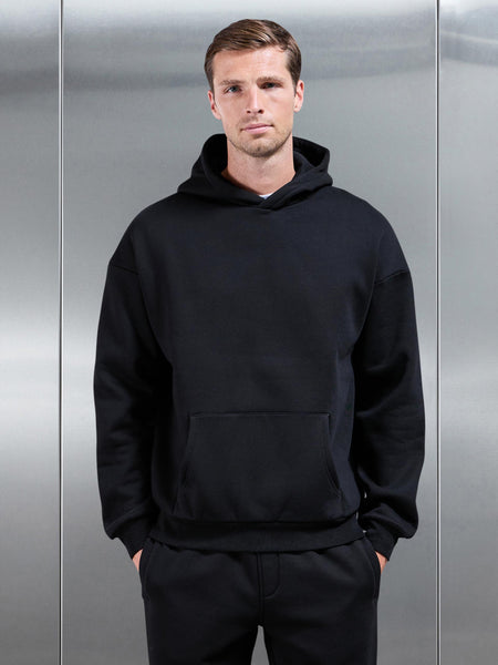 ESSENTIALRELAXEDHOODIEINBLACK-149614346571543_600x600.jpg