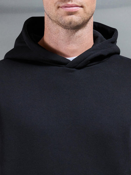 ESSENTIALRELAXEDHOODIEINBLACK-149614346571544_600x600.jpg