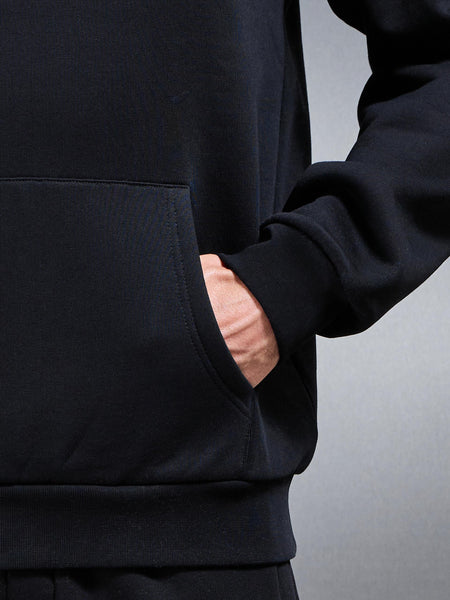 ESSENTIALRELAXEDHOODIEINBLACK-149614346571545_600x600.jpg