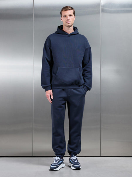 ESSENTIALRELAXEDHOODIEINNAVY-149614422920981_600x600.jpg
