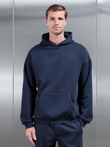 ESSENTIALRELAXEDHOODIEINNAVY-149614422920983_600x600.jpg