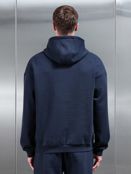 ESSENTIALRELAXEDHOODIEINNAVY-149614422920986_600x600.jpg