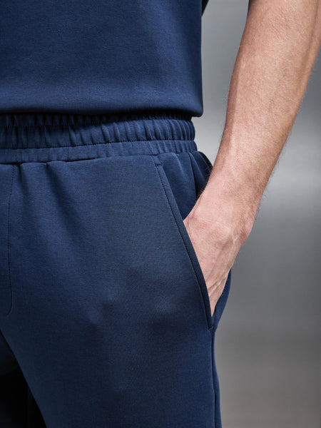 ESSENTIAL_LUXE_STRAIGHT_LEG_JOGGER_IN_NAVY_11_592fa4f1-2c8f-42b9-a2f5-d2230eb50eb9_600x600.jpg