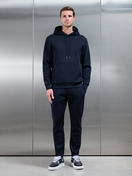INTERLOCKJERSEYHOODIEINNAVY-70138194166754copy_c0eace10-c191-4c11-8244-1a883f23888d_600x600.jpg